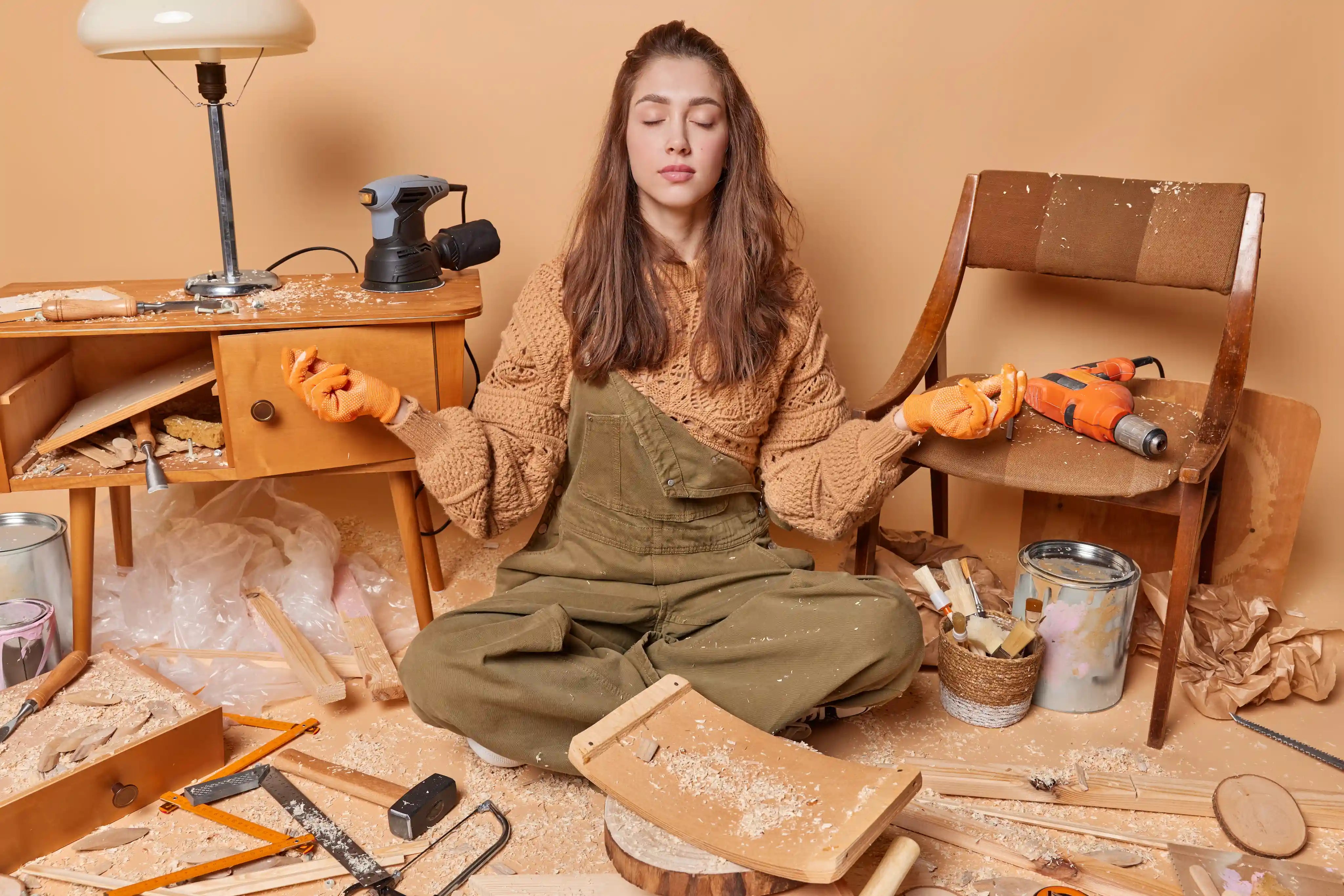 woman having a mindful moment in a wood workshop