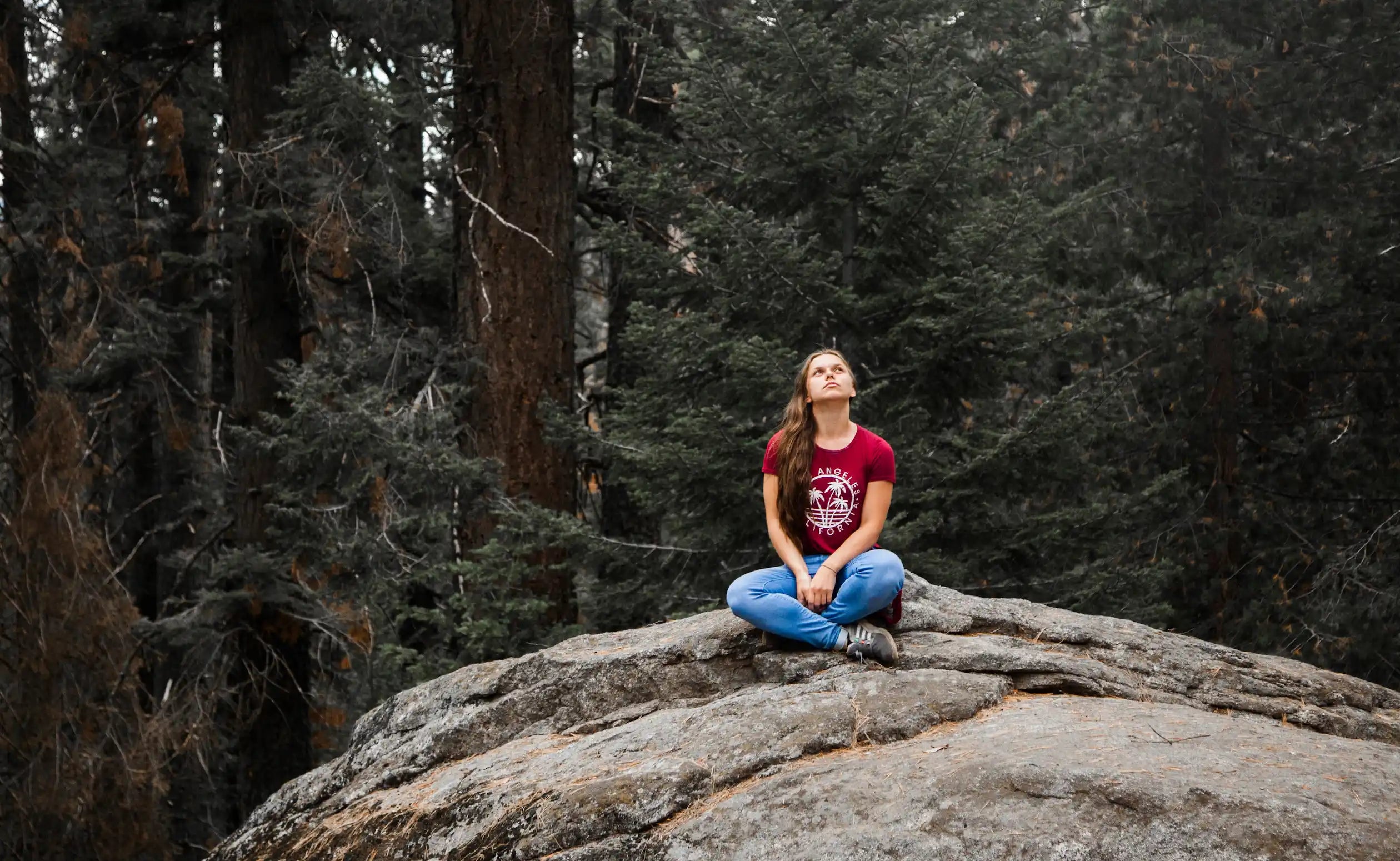 image of a thinking girl in forest