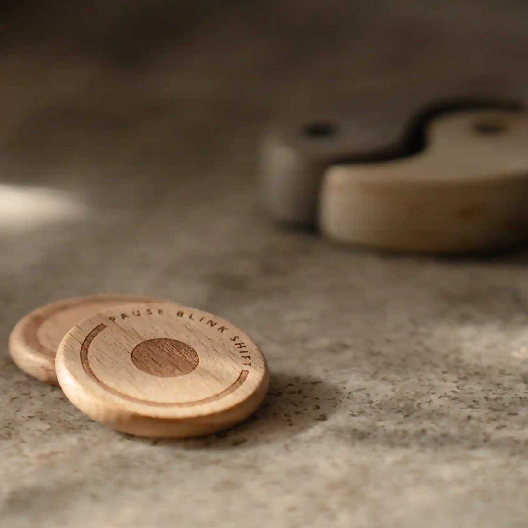 Wooden coins on a textured surface