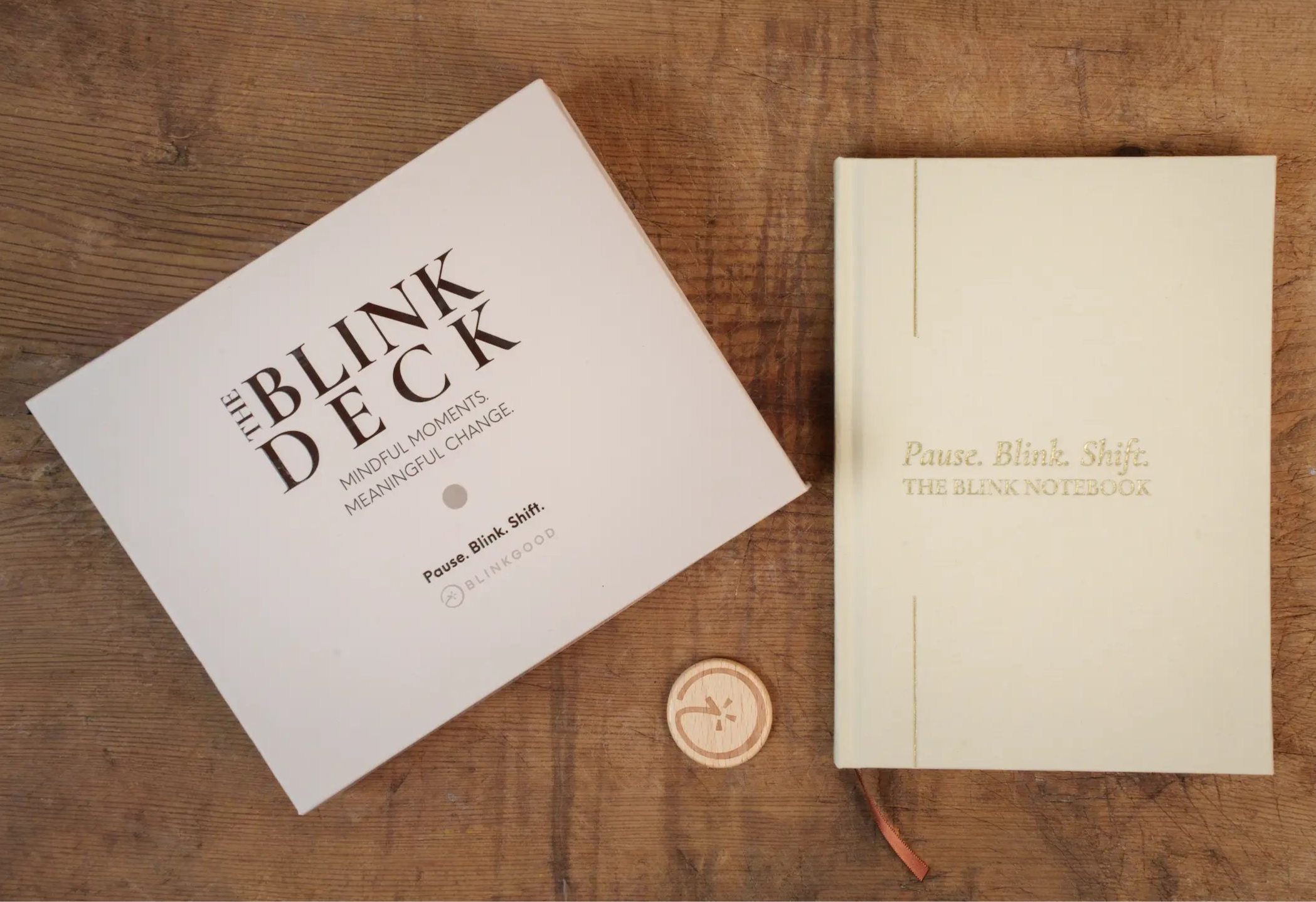 'The Blink Deck' and 'Blink Notebook' on a wooden surface.