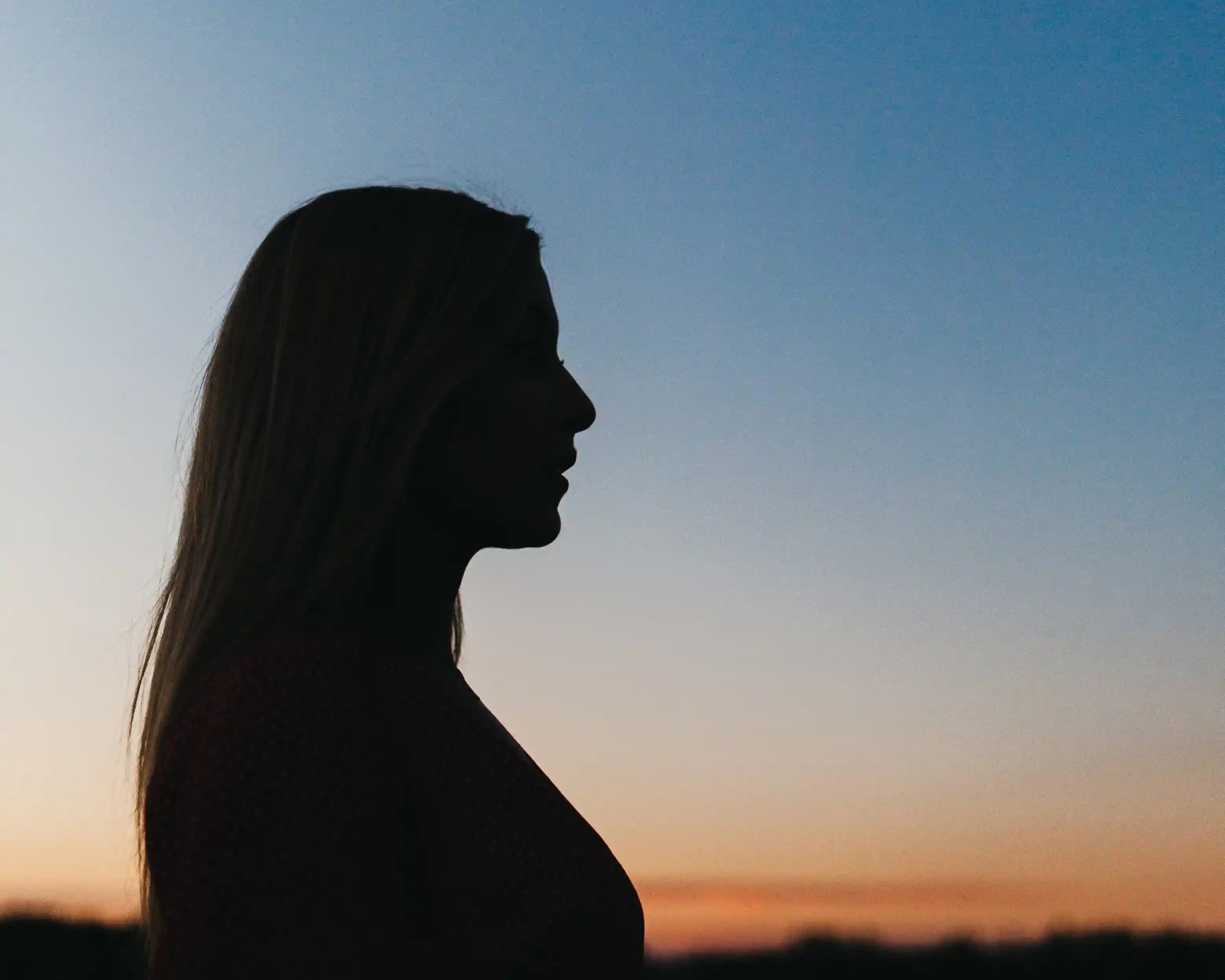 woman in dusk gaining a moment of clarity