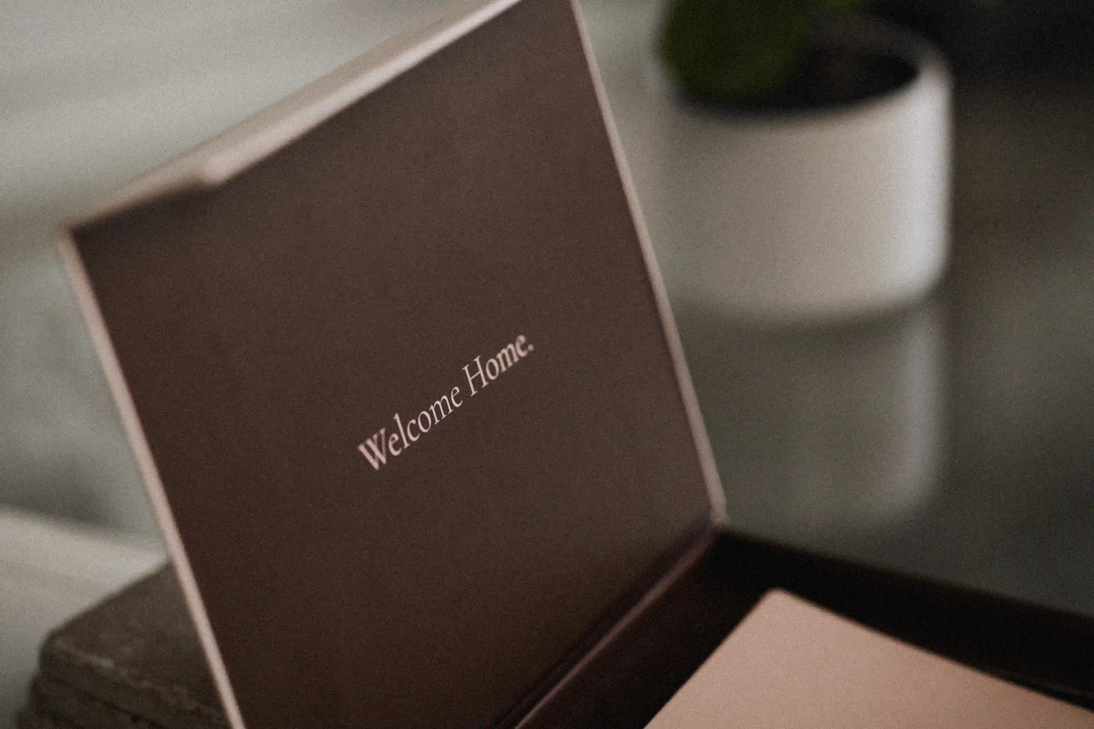 blink deck box with 'Welcome Home' text on a reflective surface