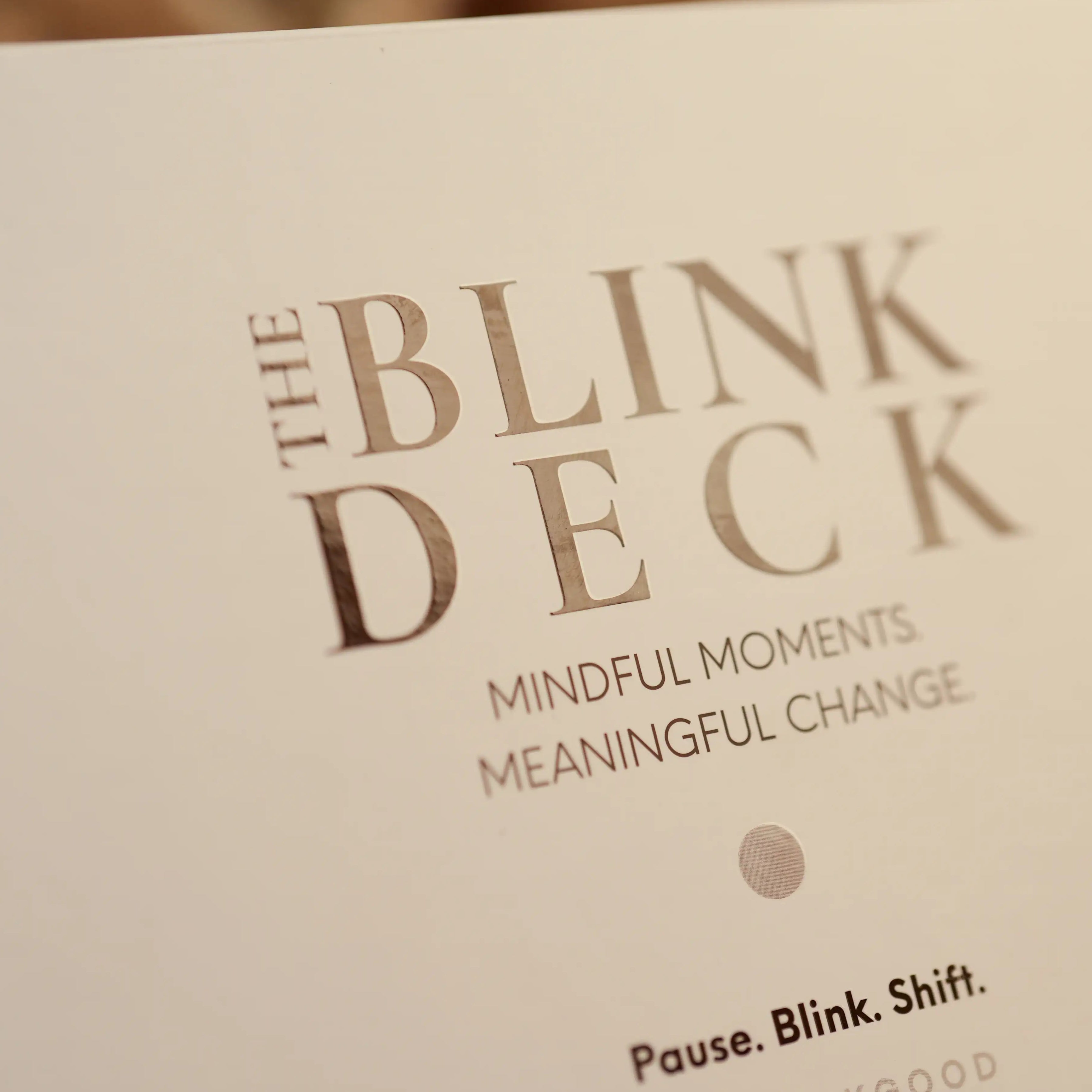 Close-up of 'The Blink Deck' cover with text about mindful moments and meaningful change.