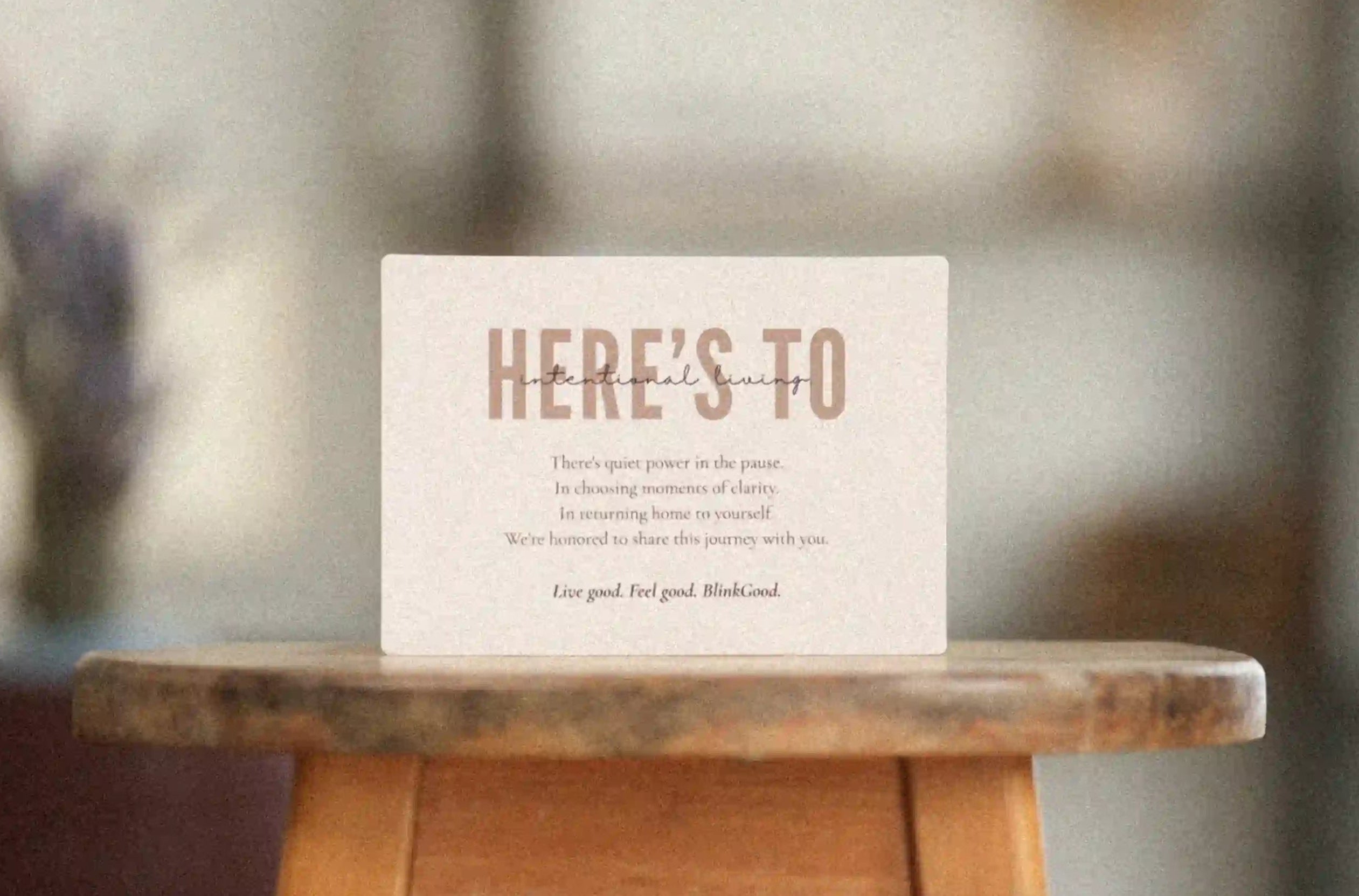 Card with text on a wooden stool outdoors